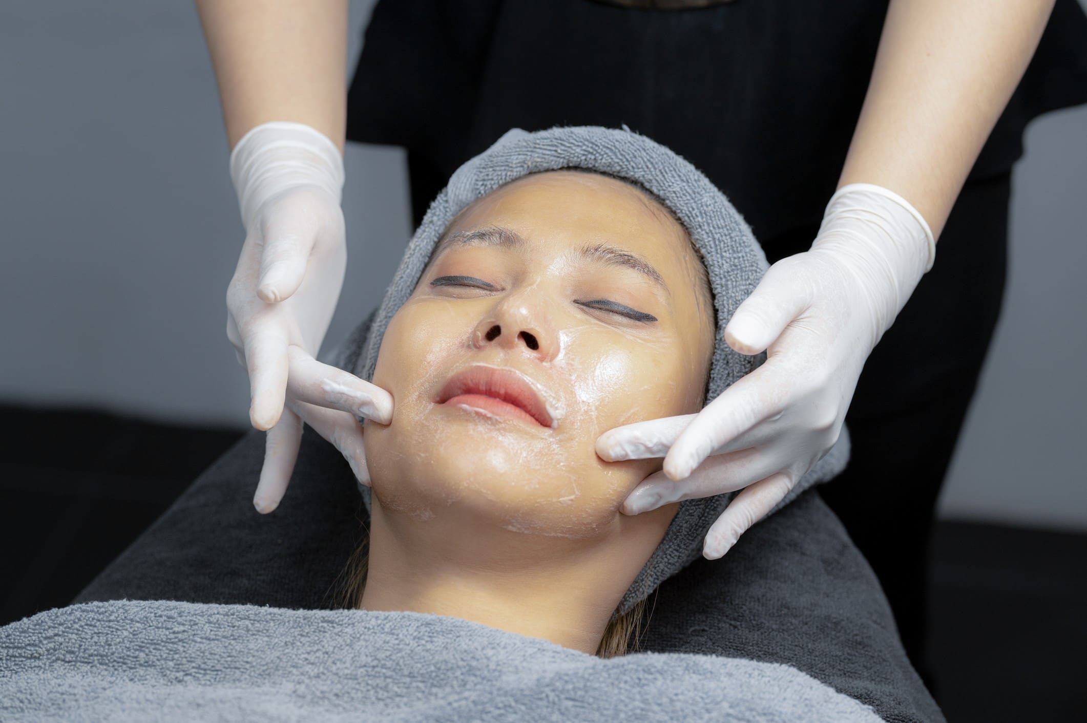 Woman receiving skincare therapy